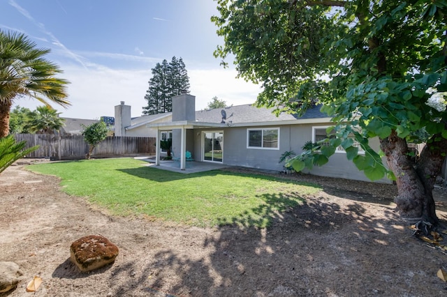 8259 N College Ave, Fresno, CA 93711 - rear view of house featuring a patio area, a chimney, and roof with shingles