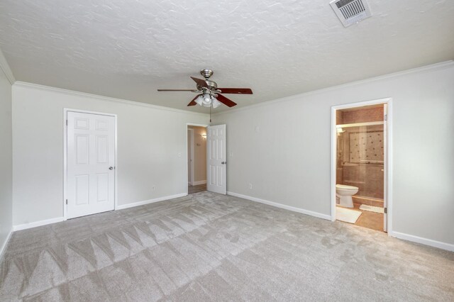 8259 N College Ave, Fresno, CA 93711 - unfurnished bedroom featuring carpet, crown molding, baseboards, connected bathroom, and a textured ceiling