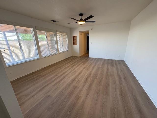 2407 W Carmen Ave, Fresno, CA 93728 - unfurnished room featuring wood finished floors, baseboards, and a ceiling fan