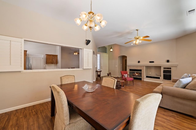 5125 N Via Amore, Fresno, CA 93711 - dining space with ceiling fan, wood finished floors, and a fireplace