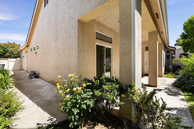 5125 N Via Amore, Fresno, CA 93711 - view of home's exterior featuring a gate, stucco siding, and a patio
