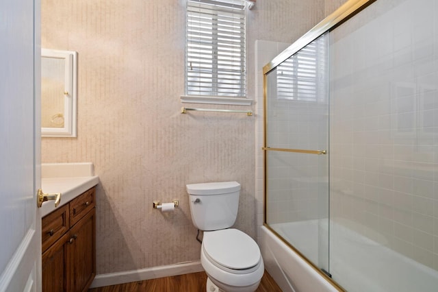 5125 N Via Amore, Fresno, CA 93711 - bathroom featuring vanity, toilet, enclosed tub / shower combo, wood finished floors, and baseboards