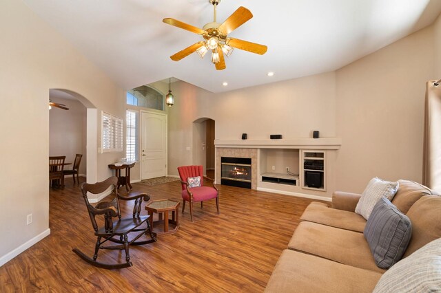 5125 N Via Amore, Fresno, CA 93711 - living area featuring arched walkways, ceiling fan, wood finished floors, a high ceiling, and recessed lighting