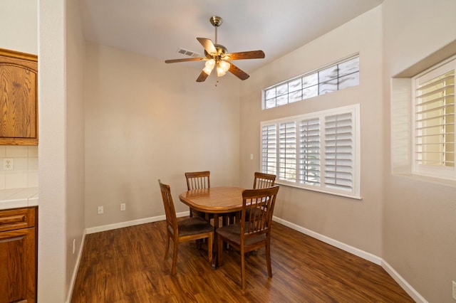 5125 N Via Amore, Fresno, CA 93711 - dining room featuring dark wood-type flooring, ceiling fan, and baseboards