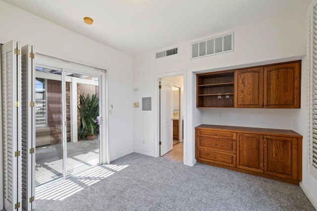 5125 N Via Amore, Fresno, CA 93711 - unfurnished bedroom with light colored carpet, baseboards, access to outside, ensuite bath, and electric panel