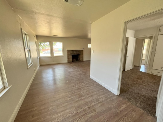 1305 E Fedora Ave, Fresno, CA 93704 - unfurnished living room featuring wood finished floors, baseboards, and a fireplace with flush hearth