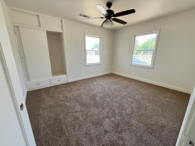 1305 E Fedora Ave, Fresno, CA 93704 - unfurnished bedroom with multiple windows, carpet, a closet, and baseboards