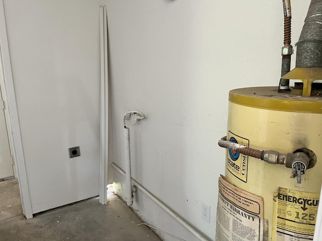 1305 E Fedora Ave, Fresno, CA 93704 - detailed view of unfinished concrete flooring and secured water heater