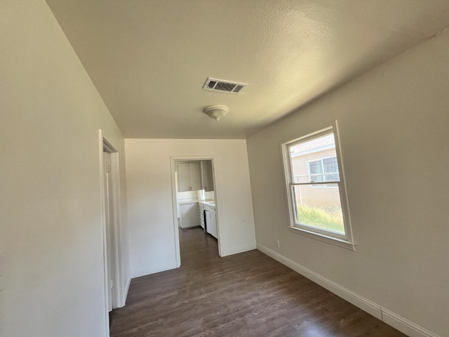 1305 E Fedora Ave, Fresno, CA 93704 - empty room featuring baseboards and dark wood-type flooring
