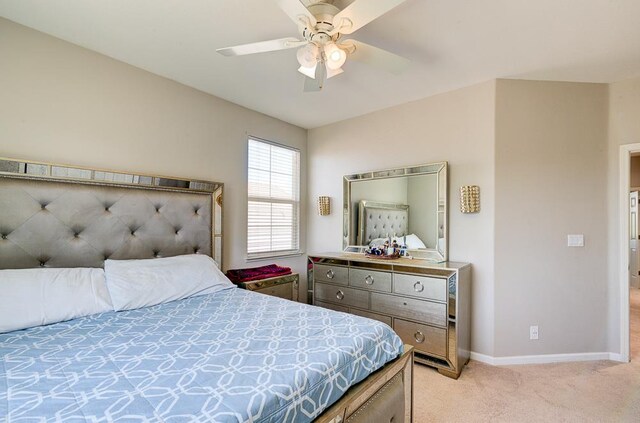 2701 Glade Ave, Madera, CA 93637 - bedroom featuring light carpet, baseboards, and a ceiling fan