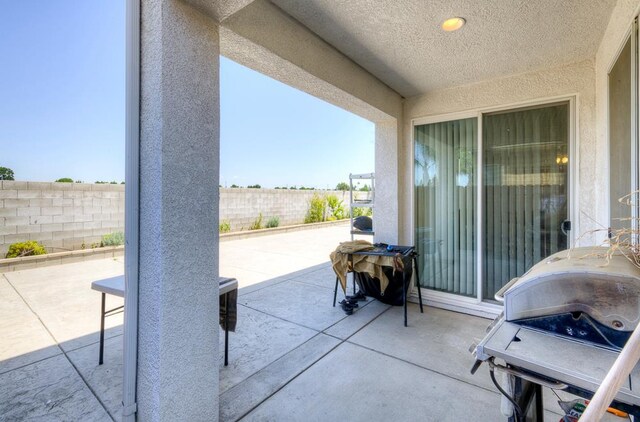 2701 Glade Ave, Madera, CA 93637 - fenced backyard with a patio area