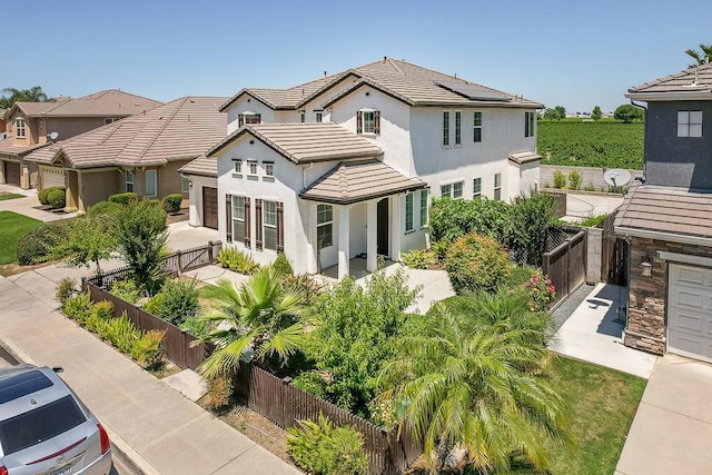 2701 Glade Ave, Madera, CA 93637 - back of property featuring a fenced backyard, a tiled roof, and stucco siding