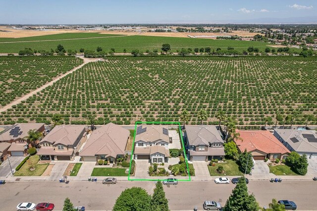 2701 Glade Ave, Madera, CA 93637 - aerial view of sparsely populated area with abundant farmland, property parcel outlined, and nearby suburban area