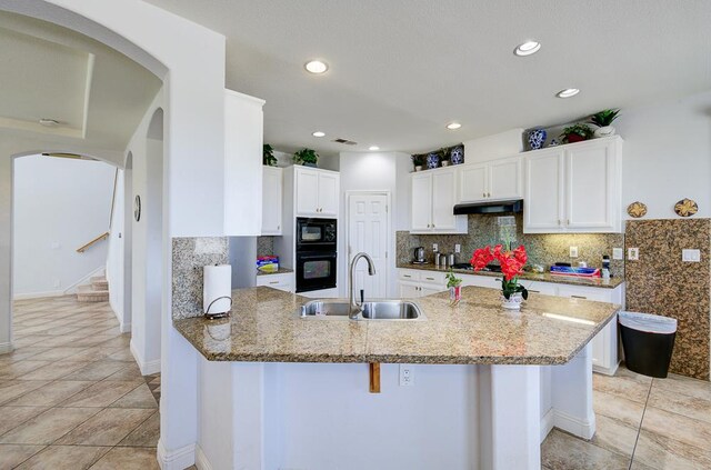 2701 Glade Ave, Madera, CA 93637 - kitchen featuring a sink, white cabinetry, tasteful backsplash, black microwave, and recessed lighting