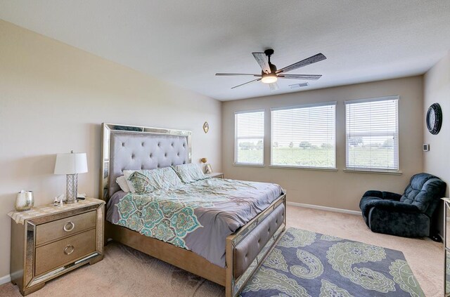 2701 Glade Ave, Madera, CA 93637 - bedroom with light carpet, baseboards, and ceiling fan