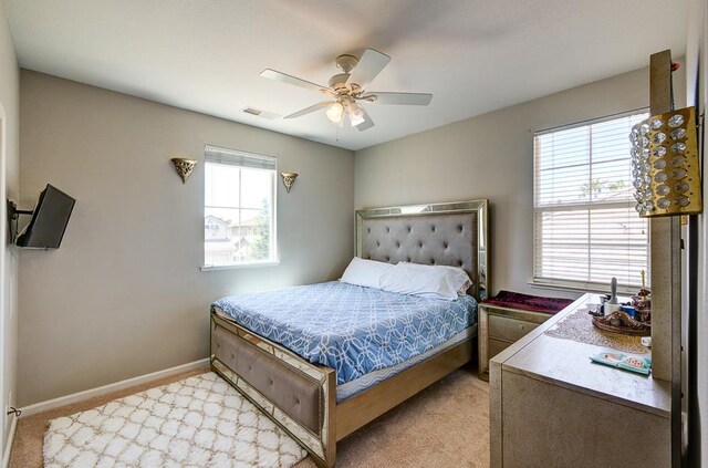 2701 Glade Ave, Madera, CA 93637 - bedroom with light colored carpet, baseboards, and ceiling fan