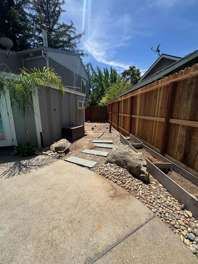 6762 N Knoll Ave, Fresno, CA 93711 - fenced backyard featuring a patio and a garden