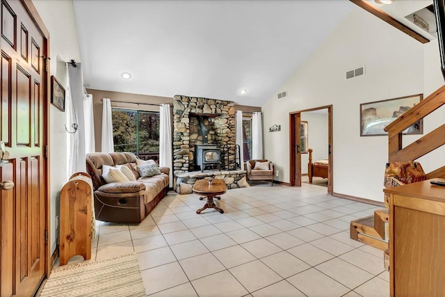 42939 Scenic Dr, Oakhurst, CA 93644 - living area with stairs, light tile patterned flooring, high vaulted ceiling, and a wood stove