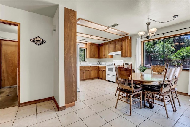 42939 Scenic Dr, Oakhurst, CA 93644 - dining area with a chandelier, plenty of natural light, and baseboards