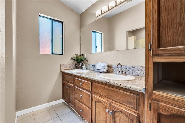 42939 Scenic Dr, Oakhurst, CA 93644 - bathroom featuring double vanity, tile patterned flooring, and baseboards