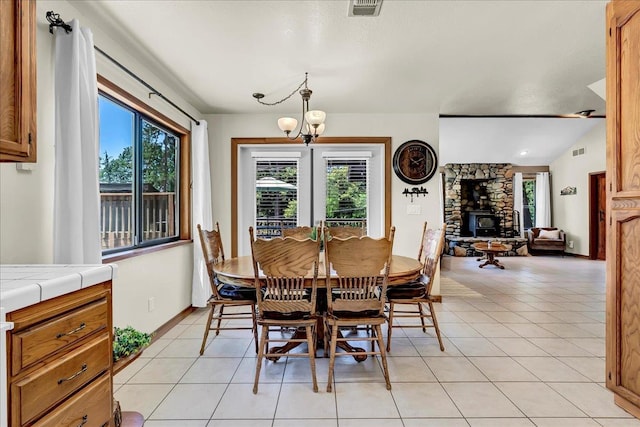 42939 Scenic Dr, Oakhurst, CA 93644 - dining room with plenty of natural light, a chandelier, light tile patterned flooring, and baseboards
