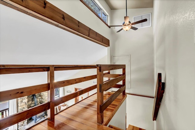 42939 Scenic Dr, Oakhurst, CA 93644 - stairs with ceiling fan, a towering ceiling, and hardwood / wood-style flooring