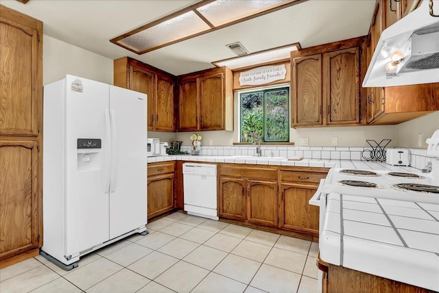 42939 Scenic Dr, Oakhurst, CA 93644 - kitchen featuring white appliances, ventilation hood, a sink, and brown cabinetry