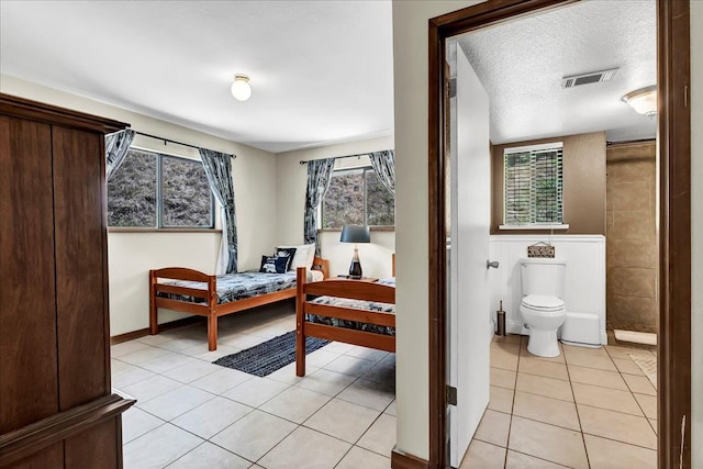 42939 Scenic Dr, Oakhurst, CA 93644 - bedroom featuring light tile patterned floors and multiple windows