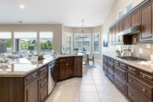 1977 N Dara Ave, Clovis, CA 93619 - kitchen with a sink, appliances with stainless steel finishes, under cabinet range hood, backsplash, and light tile patterned floors