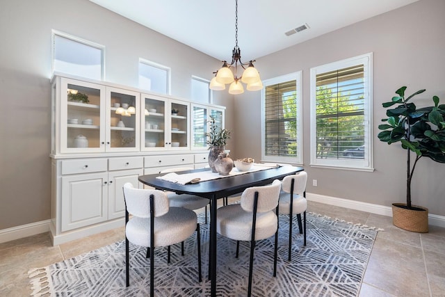 1977 N Dara Ave, Clovis, CA 93619 - dining room featuring a chandelier, light tile patterned floors, and baseboards