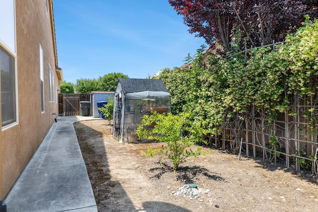 1977 N Dara Ave, Clovis, CA 93619 - fenced backyard featuring an outdoor structure and an exterior structure