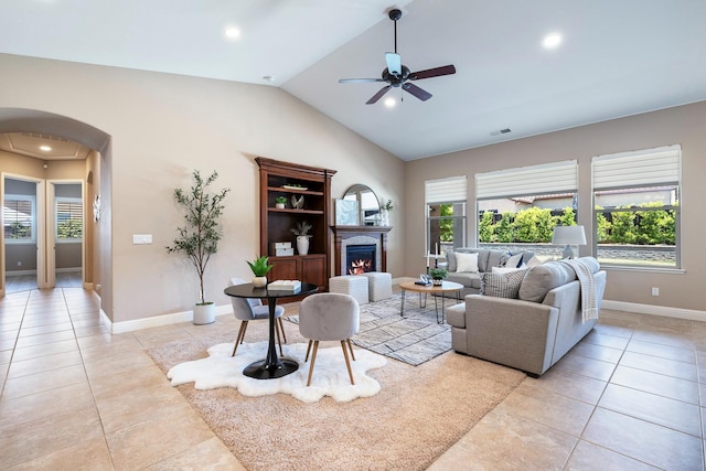 1977 N Dara Ave, Clovis, CA 93619 - living area featuring arched walkways, light tile patterned flooring, ceiling fan, healthy amount of natural light, and vaulted ceiling
