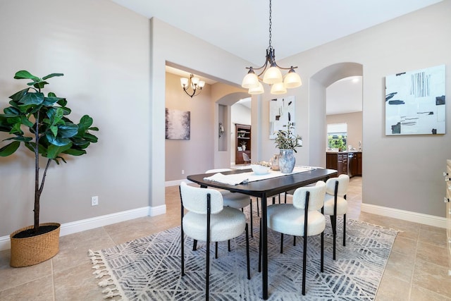 1977 N Dara Ave, Clovis, CA 93619 - dining room with arched walkways, a chandelier, and baseboards