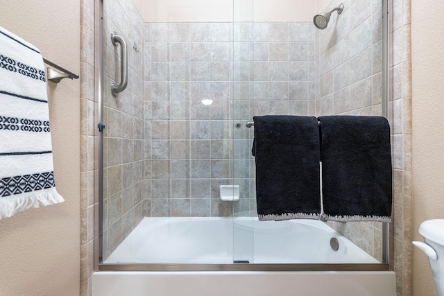 1977 N Dara Ave, Clovis, CA 93619 - full bathroom featuring combined bath / shower with glass door and a textured wall