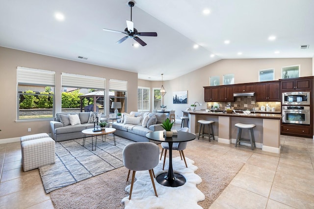 1977 N Dara Ave, Clovis, CA 93619 - living area featuring light tile patterned flooring, ceiling fan, recessed lighting, high vaulted ceiling, and baseboards