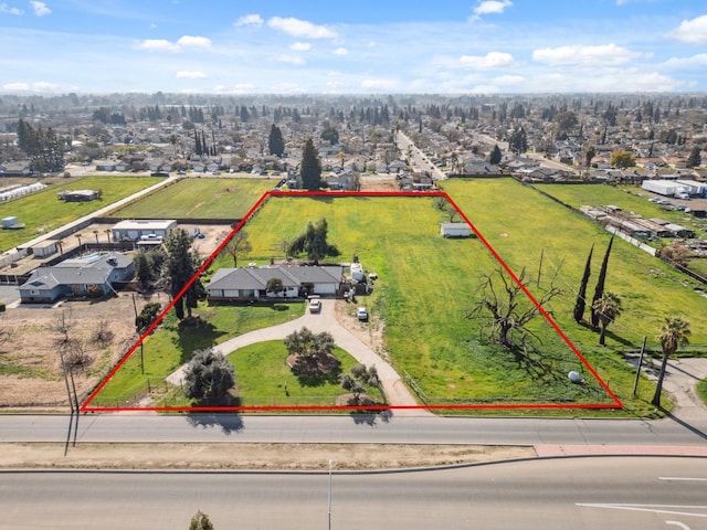 4167 W Shields Ave, Fresno, CA 93722 - aerial perspective of suburban area with property boundaries highlighted