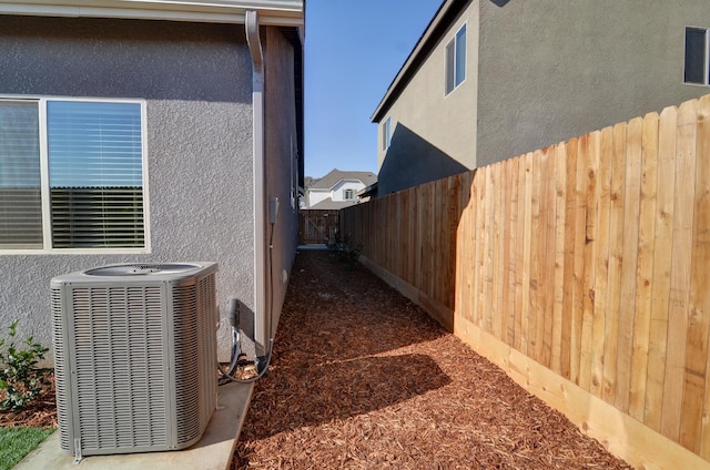 2129 La Canada Ave, Clovis, CA 93619 - view of side of home featuring central AC unit and stucco siding