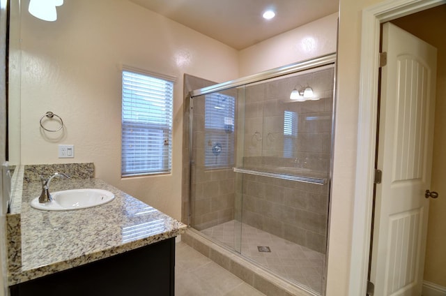 2129 La Canada Ave, Clovis, CA 93619 - full bathroom featuring vanity, a shower stall, and tile patterned floors