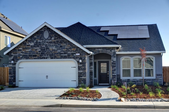 2129 La Canada Ave, Clovis, CA 93619 - french provincial home with stone siding, a shingled roof, and a garage