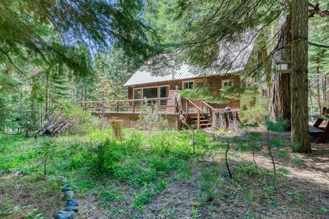 1140 Pine St, Fish Camp, CA 93623 - rear view of property featuring a wooden deck and metal roof