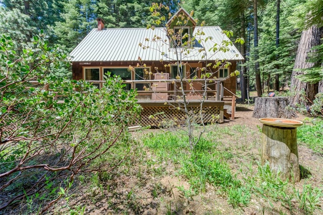 1140 Pine St, Fish Camp, CA 93623 - rear view of house with a deck and metal roof
