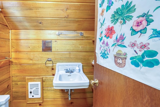 1140 Pine St, Fish Camp, CA 93623 - bathroom with a sink, wood walls, and toilet