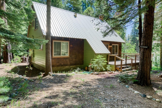 1140 Pine St, Fish Camp, CA 93623 - back of property featuring a deck, a chimney, and metal roof