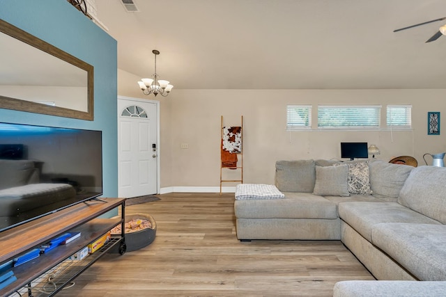 704 Rancho Vista Dr, Atwater, CA 95301 - living area with a chandelier, light wood-style floors, a ceiling fan, and baseboards