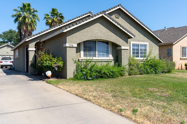 704 Rancho Vista Dr, Atwater, CA 95301 - view of front facade featuring a front lawn and stucco siding