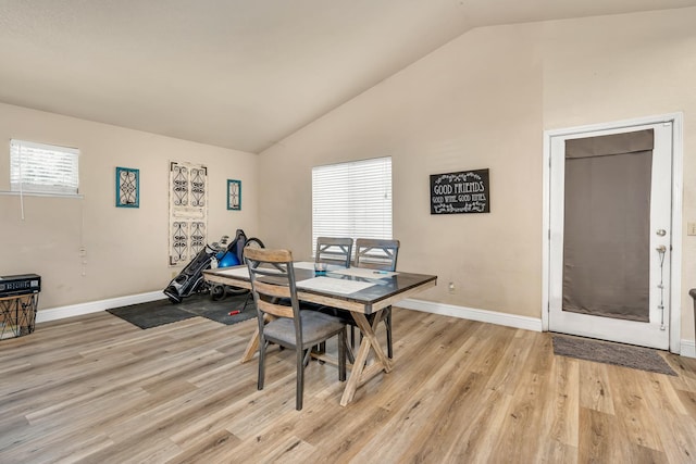 704 Rancho Vista Dr, Atwater, CA 95301 - dining space featuring vaulted ceiling, light wood-type flooring, and baseboards