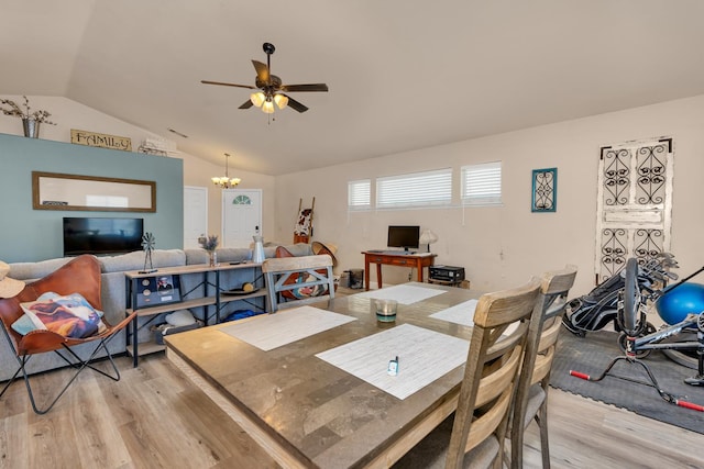 704 Rancho Vista Dr, Atwater, CA 95301 - dining area featuring light wood-style flooring, vaulted ceiling, a ceiling fan, and a chandelier