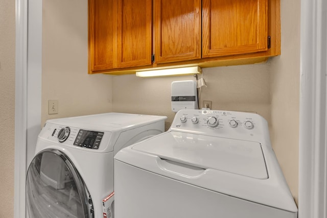 704 Rancho Vista Dr, Atwater, CA 95301 - laundry room with cabinet space and washing machine and dryer