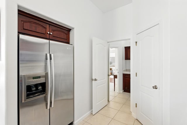 2721 Stuart Ave, Clovis, CA 93611 - kitchen featuring stainless steel fridge, light tile patterned floors, and baseboards