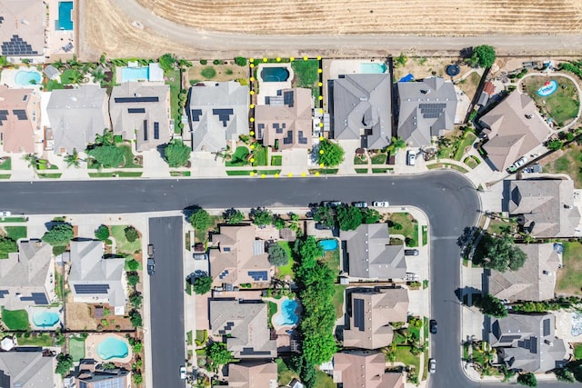 2721 Stuart Ave, Clovis, CA 93611 - aerial overview of property's location with nearby suburban area, property parcel outlined, and a pool area
